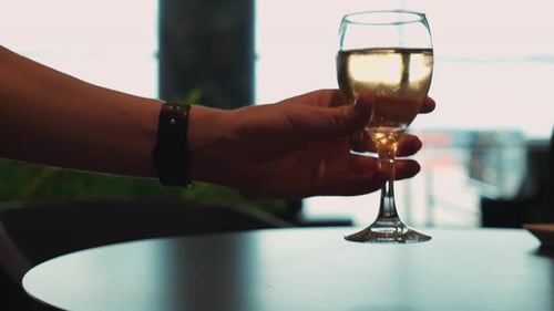 Wine Glass Placed on Table in Urban Setting