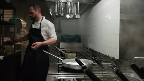 Chef Preparing The Frying Pan For The Meal