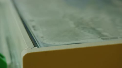 Soapy water on glass for cleaning purposes