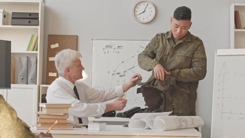 Asian Recruit Learning to Use Tactical Vest in Military Academy