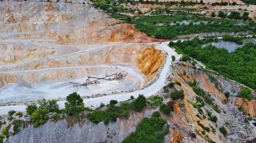 Natural Quarry is Located Near Road Against Backdrop of Rhodope Mountains and Hills with Forests and