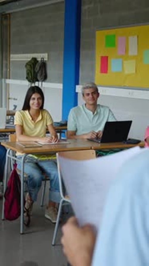 Young Adults Studying in Classroom During Presentation