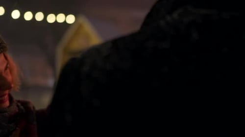 Friends Celebrate in Snow with Sparklers at Night