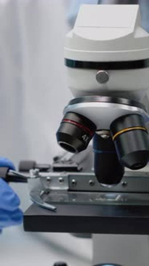 Vertical Video Close Up of Scientific Microscope in Laboratory