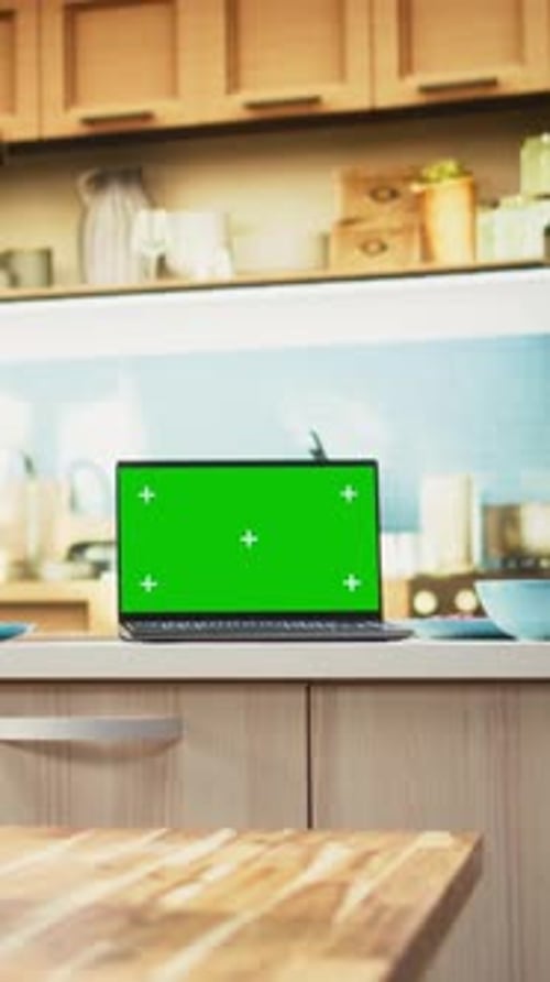 Vertical Video Green Screen Laptop in Empty Kitchen with Island and Modern Appliances