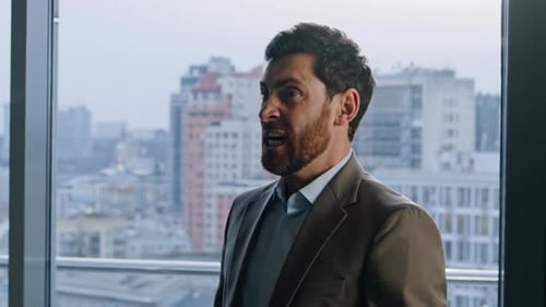 Mad Manager Expressing Frustration at Office with City View Businessman Yelling