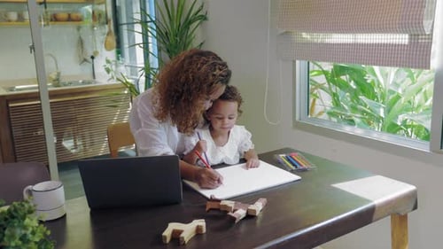 Mother and Child Drawing Together at Home