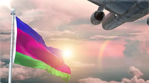 Waving Flag and Passenger Airplane Flying Over Clouds at Sunset