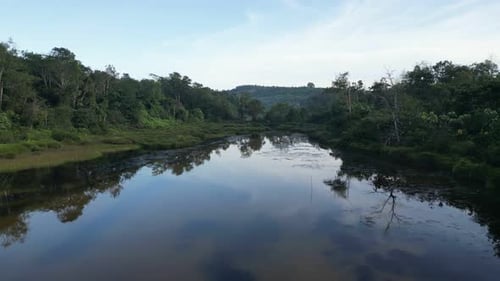 A river with a reflection of the sky on the water