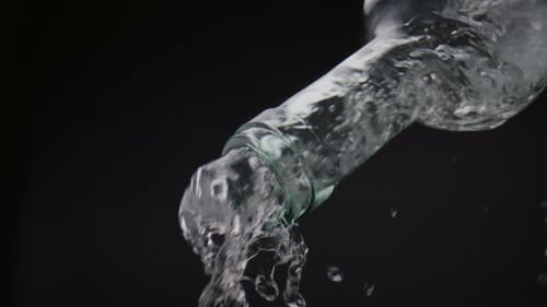 Water Pouring from Bottle in Slow Motion