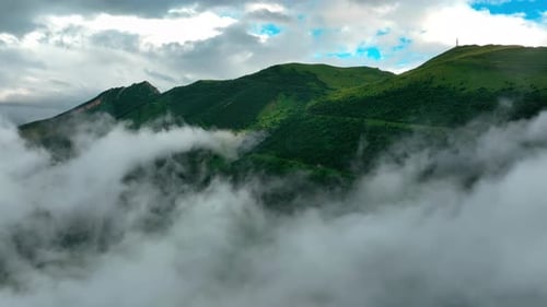 Mountain Peaks Emerging From Morning Mist Misty Mountain Landscape Reveals Peaks Under a Cloudy Sky