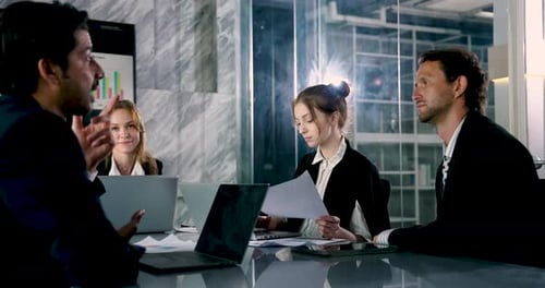 Team Discussing Ideas in Modern Office Space