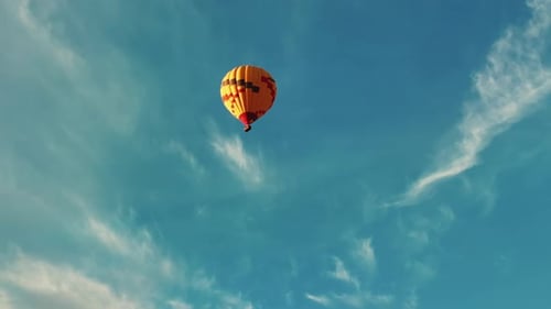 Hot Air Balloon Ride On A Sunny Blue Sky Over Sedona, Arizona, USA. Low Angle