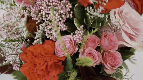 Close up with upward motion on a variety of flowers professionally arranged.