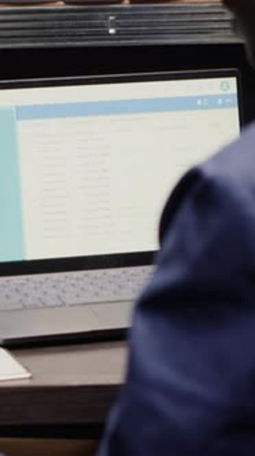 Analyst Reviewing Documents at Work