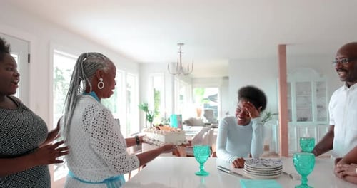 Family Celebrates a Child's Birthday with Cake