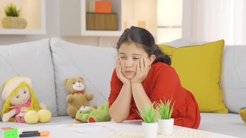 Depressed girl child unhappy and sad at home.