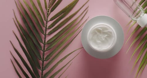 Jars Cream with Palm Leaf Rotate for Beauty Treatment Top View