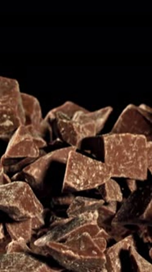 Super Slow Motion Pieces of Dark Milk Chocolate Filmed on a Highspeed Camera at 1000 Fps