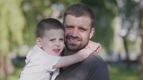Father and Son Happy Portrait in Summer in Park