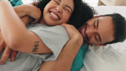 Happy Couple Embracing in Bed, Intimate Moment