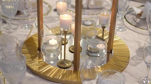 Elegant Wedding Table Decor with Candles and Gold