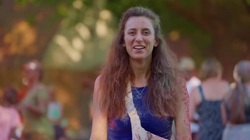 Smiling Woman Celebrates Holi with Colorful Powder