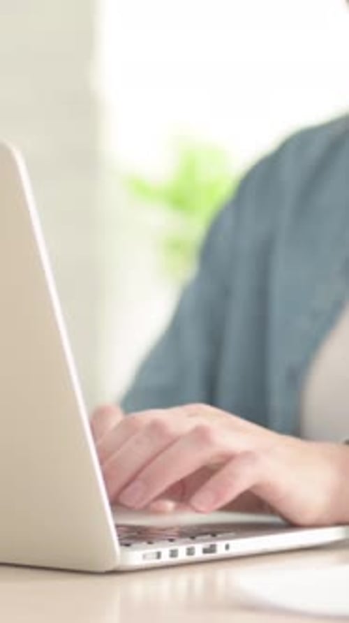 Close Up of Female Typing on Laptop, Vertical Video