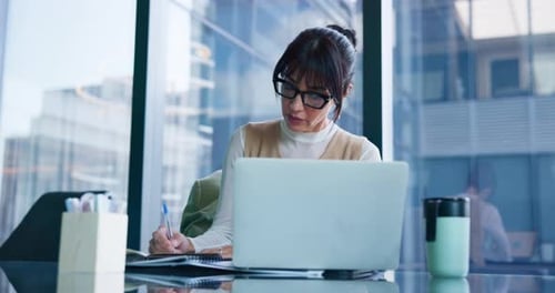 Notebook, thinking and laptop with business woman in office for patent lawyer