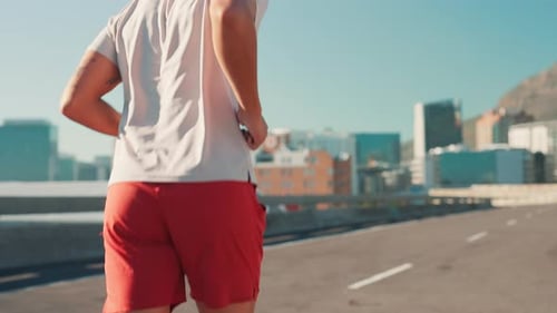 Running, athlete and fitness on road, man and exercise for sports in city
