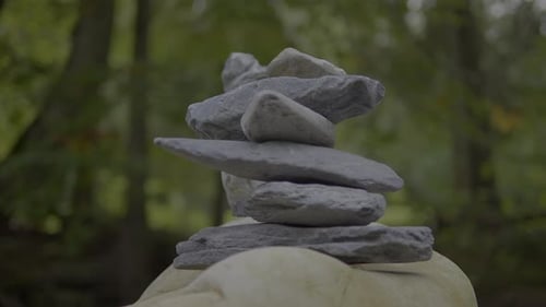 Balancing Stones in a Forest Creates a Serene Environment for Meditation and Mindfulness