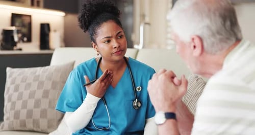Home Healthcare Nurse Visiting Senior Male Patient