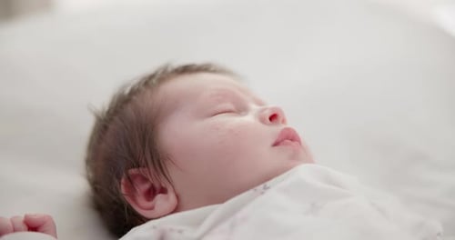Baby, face and sleeping in the morning on nursery bed and blanket with nap and rest