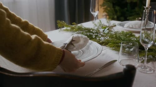 Preparing Elegant Table for Christmas Dinner