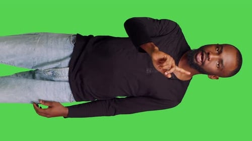Vertical Video Front View of African American Man Showing No Symbol with Finger