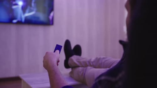 Man Watching Television Reclined With Feet Up