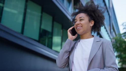 Young Woman Talking on Mobile Phone in City