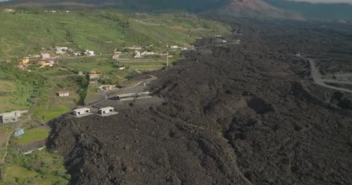 Volcanic aftermath on tropical island with large basalt rock flow