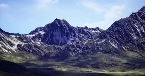 Majestic Mountain Landscape Under Clear Blue Sky During Daylight Hours