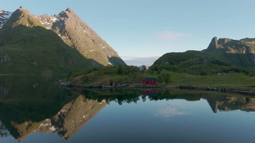 Lofoten island traditional red house. Norway Scandinavia nature with sea, fjord, mountains and water