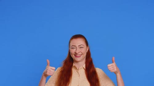 Adult Woman Showing Thumbs Up and Pointing Over Head on Blank Space Place for Advertisement Logo