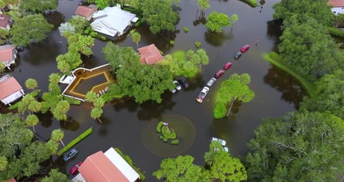 Flooded Road with Sunken Cars in Surrounded with Water Florida Residential Area Consequences of