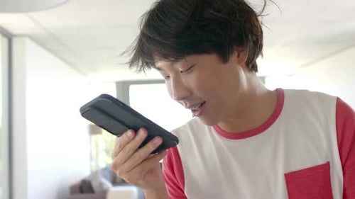 Young Adult Using Voice Message on Smartphone