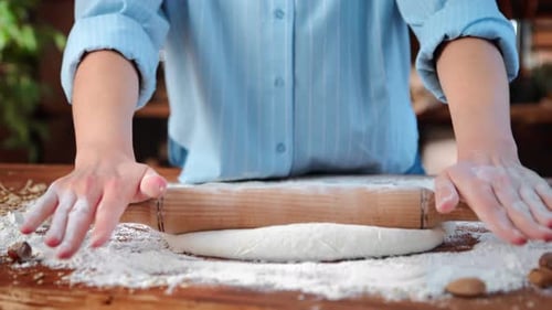 Woman Baker Rolling Dough for Pie or Pasta Closeup View of Female Hands on Kitchen Table at Home