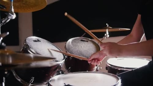 Drummer Playing Drums in a Recording Studio