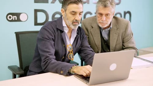 Men Work at Laptop in Modern Bright Office