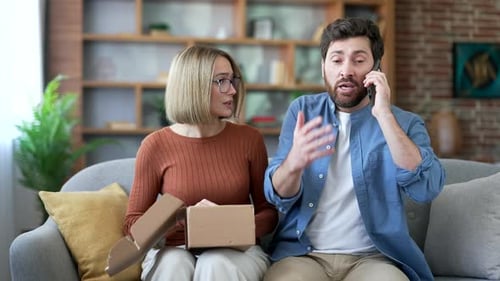 Upset Couple with Delivery Problem on Phone at Home