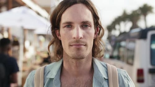 Travel, face and man with holiday in city for urban adventure, summer trip and vacation abroad