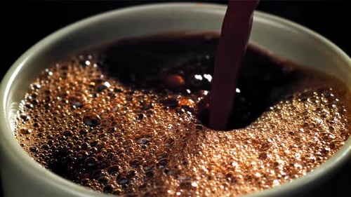 Coffee Being Poured into Mug Close Up