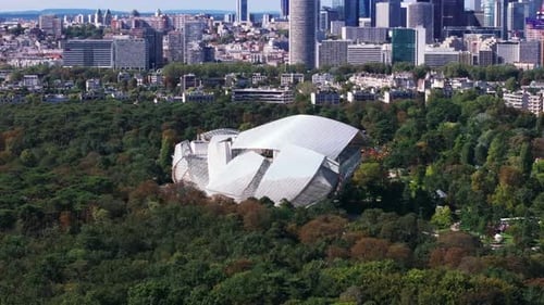 Aerial Slide and Pan of Modern Design Museum Building in Park Fondation Louis Vuitton and Business